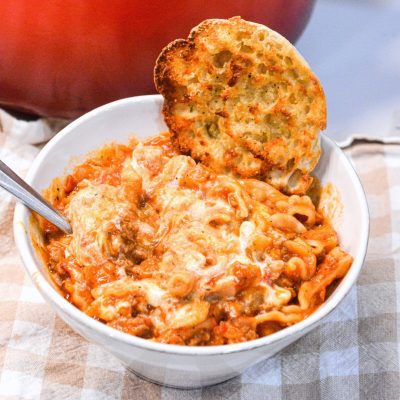 Lasagna soup recipe with ricotta is made with ground pork or beef, Italian seasonings, your favorite pasta, and topped with cheese.