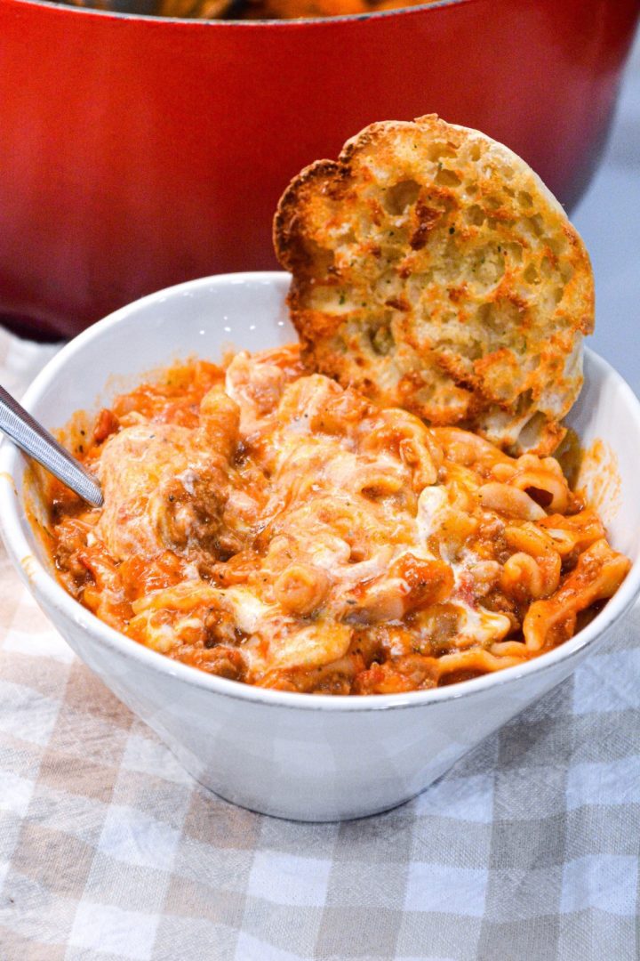 Lasagna soup recipe with ricotta is made with ground pork or beef, Italian seasonings, your favorite pasta, and topped with cheese.