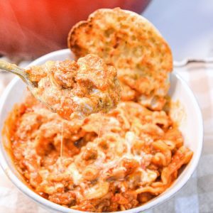 Lasagna soup recipe with ricotta is made with ground pork or beef, Italian seasonings, your favorite pasta, and topped with cheese.