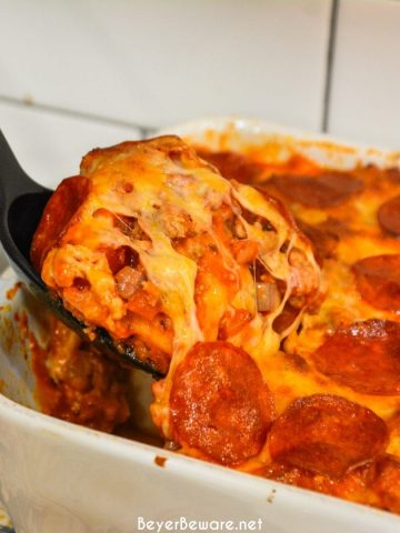 Bubble-Up pizza casserole is an easy weeknight meal since the casserole is made with grands biscuits, spaghetti sauce and your favorite pizza toppings.