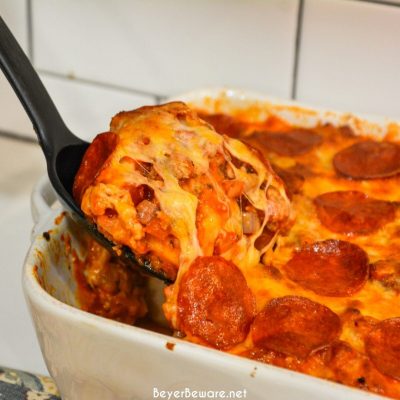 Bubble-Up pizza casserole is an easy weeknight meal since the casserole is made with grands biscuits, spaghetti sauce and your favorite pizza toppings.