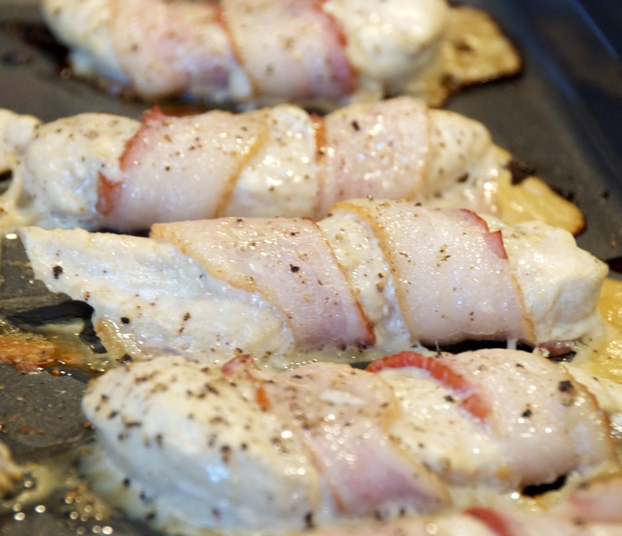 Half baked bacon wrapped chicken