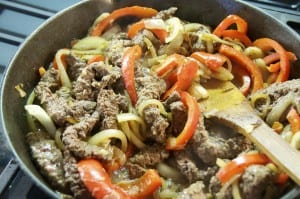 sliced cubed steak in onions and peppers