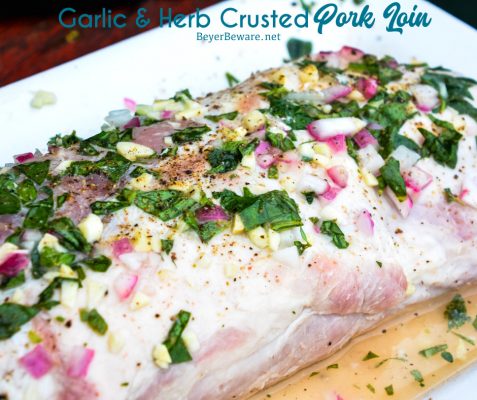 Garlic and Herb Crusted Grilled Pork Loin uses fresh herbs, garlic, and onions with simple wine, lemon juice, and oil marinade then grilled to juicy pork loin perfection.