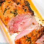 Garlic and Herb Crusted Grilled Pork Loin uses fresh herbs, garlic, and onions with simple wine, lemon juice, and oil marinade then grilled to juicy pork loin perfection.