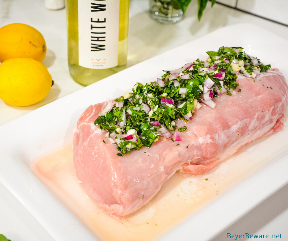 Garlic and Herb Crusted Grilled Pork Loin uses fresh herbs, garlic, and onions with simple wine, lemon juice, and oil marinade then grilled to juicy pork loin perfection. 