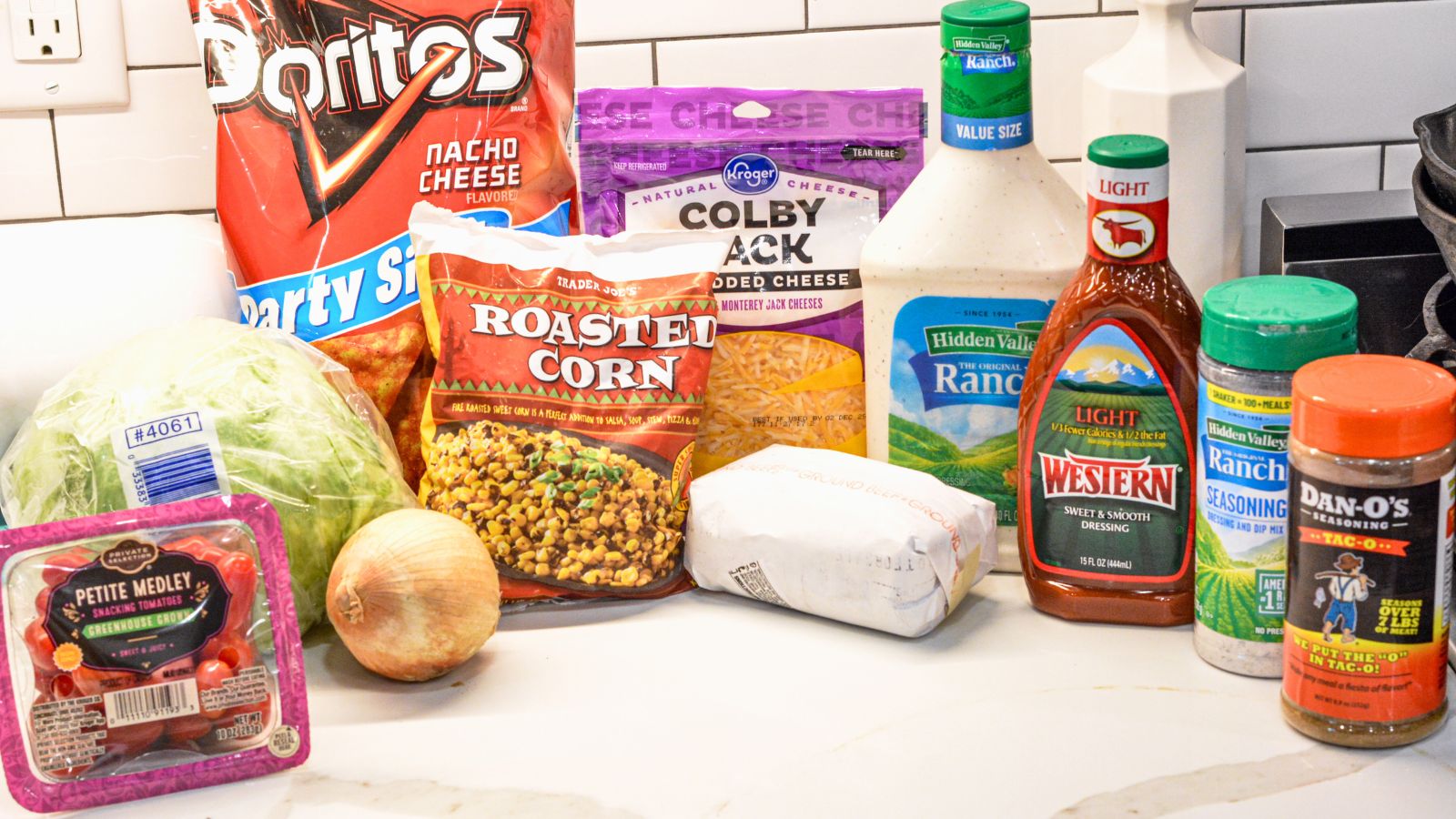 Ground Beef

Taco Seasoning

Ranch Dressing Seasoning

Lettuce

Tomatoes

Onions

Cheese

Western Dressing

Ranch Dressing

Nacho Cheese Doritos

Optional Ingredients - Black beans, corn, olives, avocado