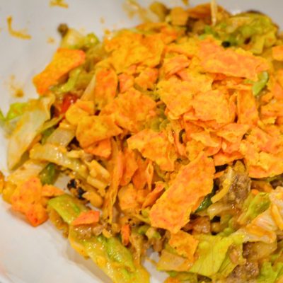 Top with crushed tortilla chips when you serve. Either top the entire salad or let each person top their invidual salad with Doriotos.