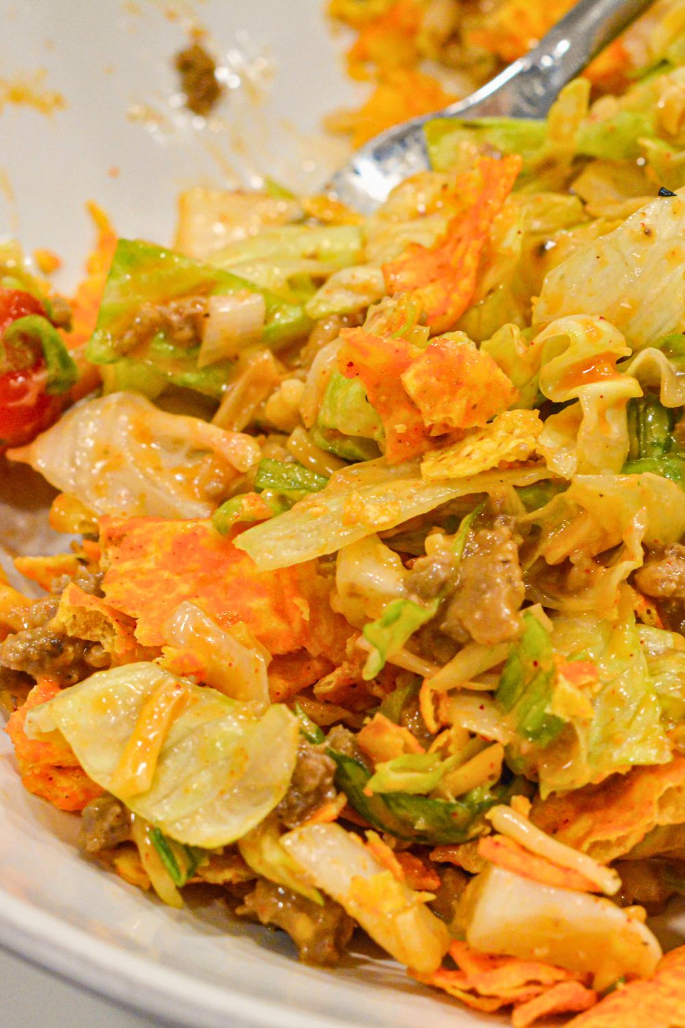 Make the best taco salad with seasoned ground beef, ranch and taco seasoning, and a delicious mix of ranch and Western dressing. This easy taco salad recipe is perfect for quick dinners and potlucks!