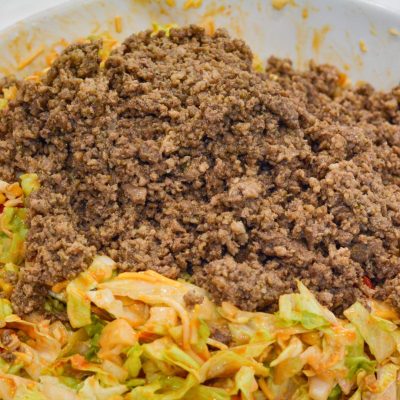 Add the ground beef taco meat to the salad and stir to combine the taco salad just before serving.