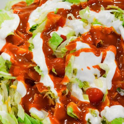 Mix ranch and Western dressing together by drizzling over the salad.