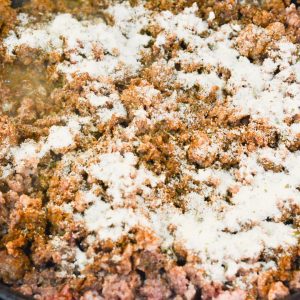In a large skillet over medium heat, brown the ground beef. Drain the fat, then stir in the taco seasoning and ranch seasoning with ¼ cup water.