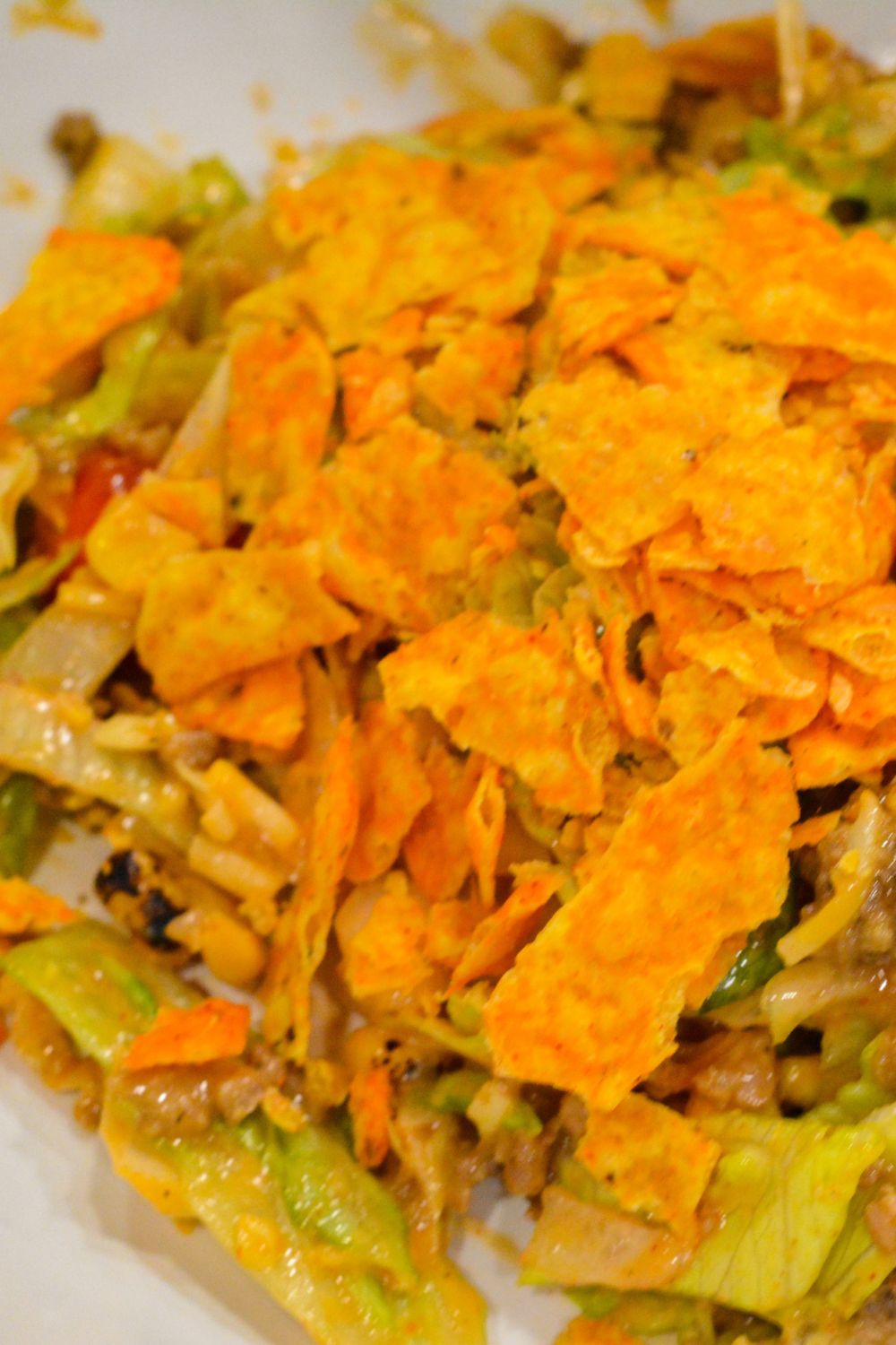 Make the best taco salad with seasoned ground beef, ranch and taco seasoning, and a delicious mix of ranch and Western dressing. This easy taco salad recipe is perfect for quick dinners and potlucks!