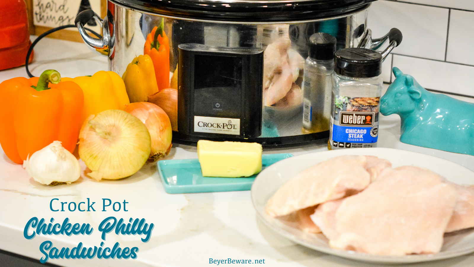 Crock pot chicken philly sandwiches are an easy pulled chicken sandwiches made with onion, peppers, chicken, steak seasoning, and butter.