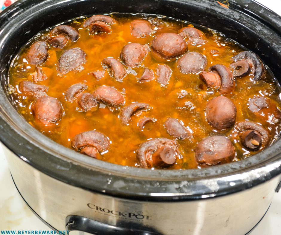 Crock pot mushrooms and onions with red wine, butter and garlic make an incredible low-carb side dish after slow cooking for 12 hours.