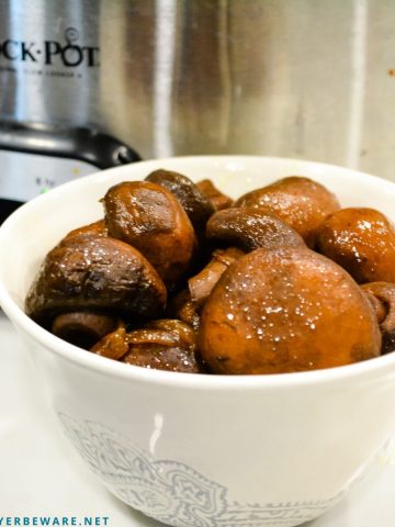 Crock pot mushrooms and onions with red wine, butter and garlic make an incredible low-carb side dish after slow cooking for 12 hours.