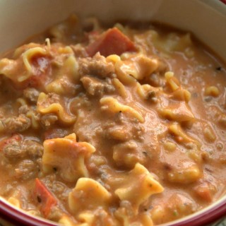 Creamy Italian Sausage Soup is a twist on chili or lasagna soup. Robust tomato and pork sausage flavor come together in this easy soup recipe. Plus easily low carb and gluten free with the omission of the pasta. #soup #ItalianRecipes #QuickRecipes #EasyRecipes