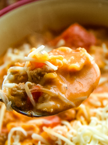 Creamy Italian Sausage Soup recipe is my new go-to tomato and sausage soup recipe that is rich and hearty, perfect for an easy dinner.