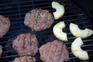 This grilled pineapple pork burger recipe gives an Asian zip to a farm staple, pork burger.