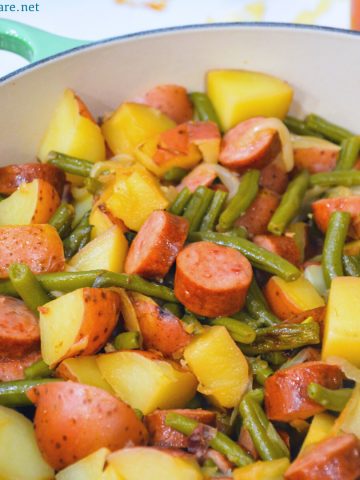 Hoosier Stew is Indiana comfort food with fresh green beans, red potatoes, and smoked sausage that has simmered in caramelized onions and garlic for an easy dinner recipe.