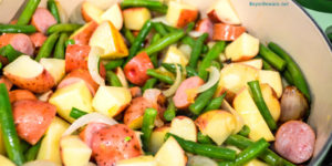 Hoosier Stew is Indiana comfort food with fresh green beans, red potatoes, and smoked sausage that has simmered in caramelized onions and garlic for an easy dinner recipe.