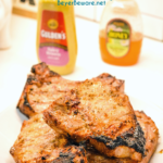 Honey Mustard Pork Chops are a quick and easy pork chop recipe with just four ingredients creating flavorful chops that can be grilled or baked.