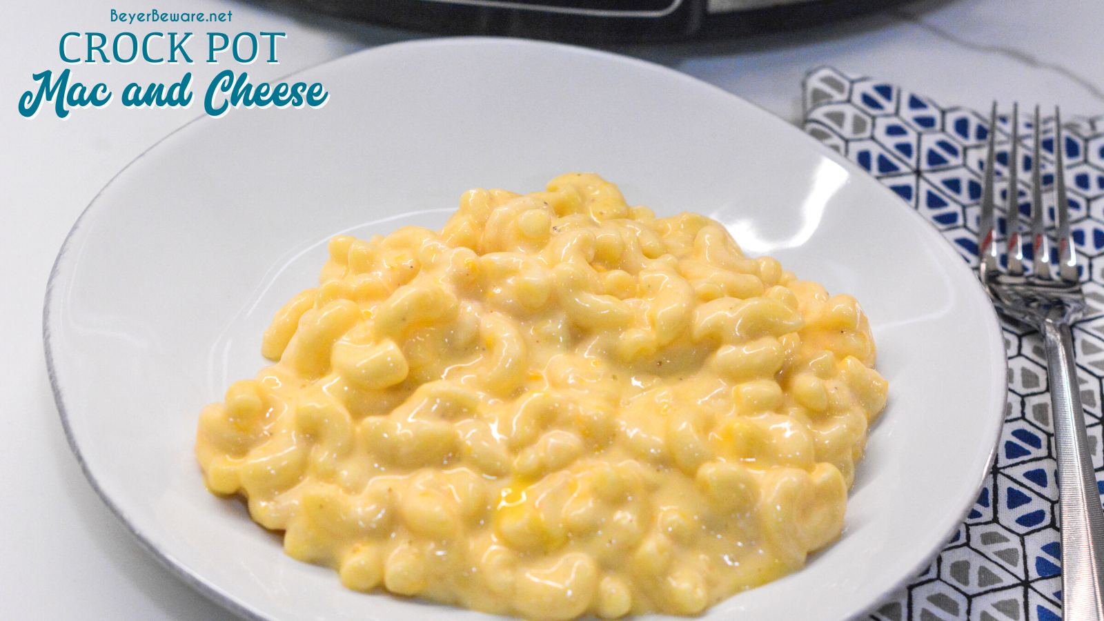 Crock pot mac and cheese recipe is made with alfredo sauce, sour cream, velveeta for ultimate slow cooker mac n cheese.