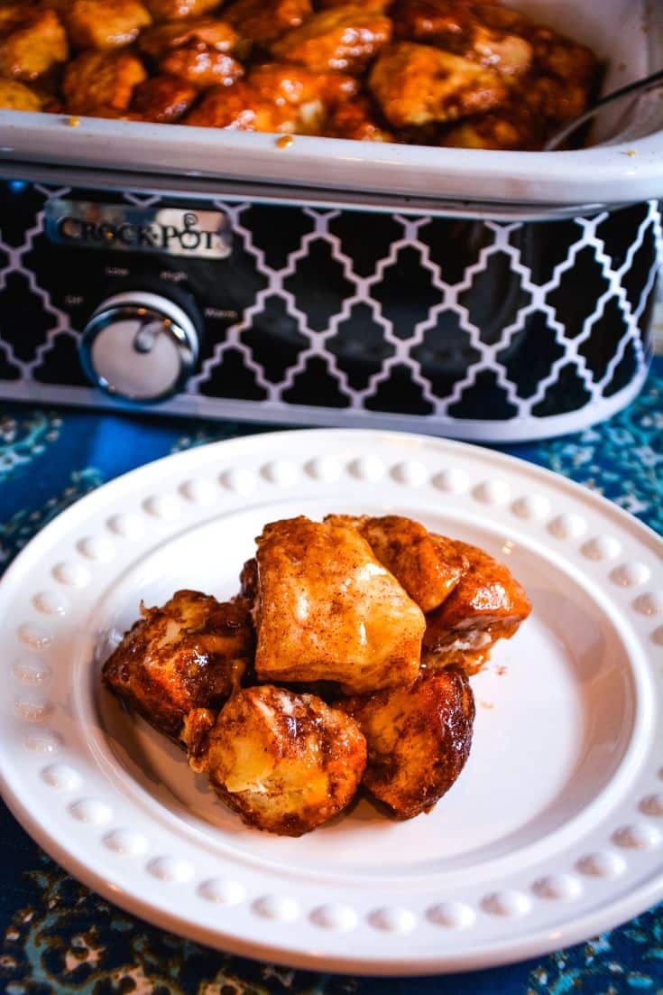 Easy crock pot monkey bread made with Grands biscuits, cinnamon, and a buttery brown sugar caramel. This casserole crock pot pull-apart bread is ready in 2 hours &mdash; no oven required.