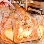 Crock pot sausage tortellini soup is a creamy tomato soup made with cheese tortellini and Italian sausage in two to three hours in the crockpot for a hearty and filling soup recipe.