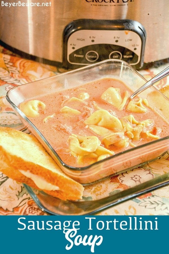 Crock pot sausage tortellini soup is a creamy tomato soup made with cheese tortellini and Italian sausage in two to three hours in the crockpot for a hearty and filling soup recipe.