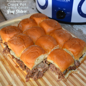 Crock Pot French onion beef sliders recipe is a shredded French onion beef roast made with canned French onion soup, onions, butter and beef broth used to make cheesy sliders on Hawaiian rolls.