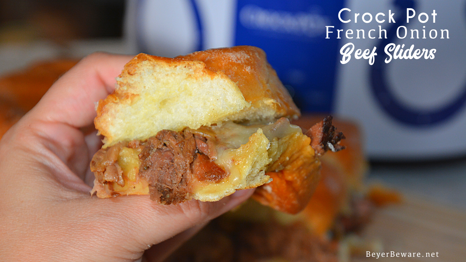 Crock Pot French onion beef sliders recipe is a shredded French onion beef roast made with canned French onion soup, onions, butter and beef broth used to make cheesy sliders on Hawaiian rolls.