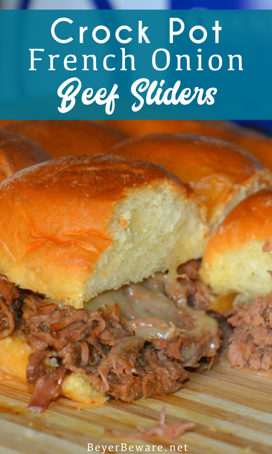 Crock Pot French onion beef sliders recipe is a shredded French onion beef roast made with canned French onion soup, onions, butter and beef broth used to make cheesy sliders on Hawaiian rolls.