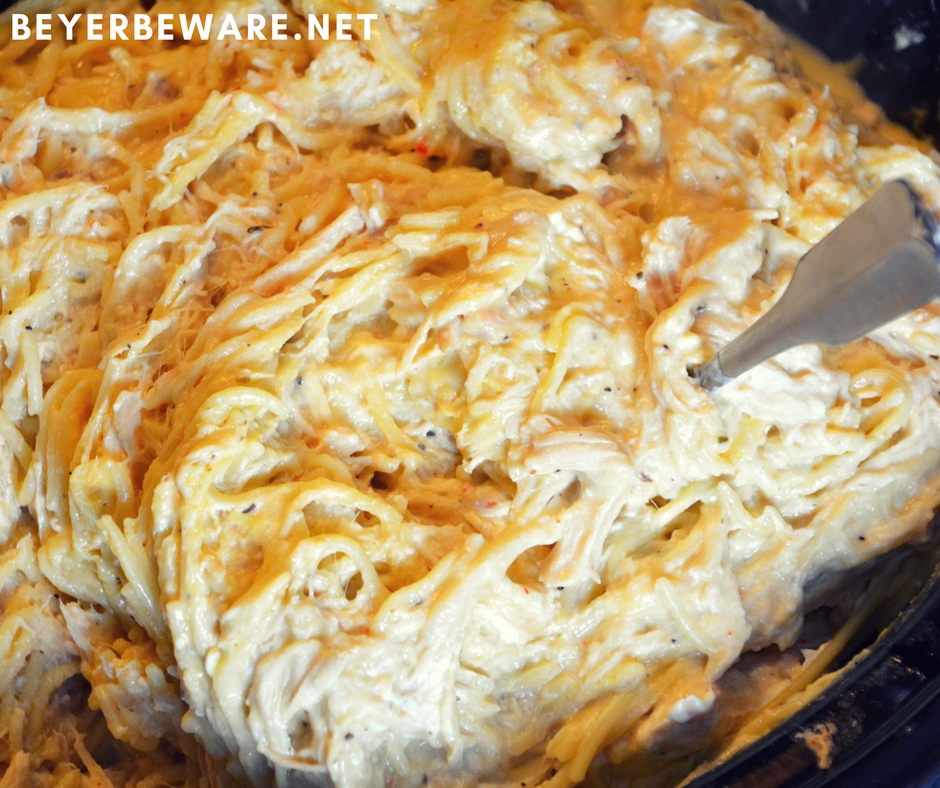 Crock pot creamy chicken spaghetti is the perfect chicken pasta dish with cream cheese and Italian seasoning to give the dish great alfredo flavors when you are needing to feed a large crowd or a hungry family.