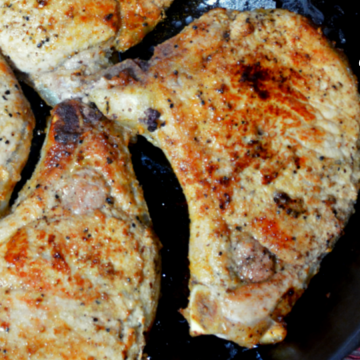 Pan-Fried pork chops recipe has no flour, no marinading, no waiting, just juicy, flavorful pork chops cooked in a buttered cast iron skillet in under 30 minutes.