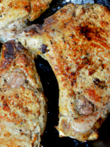 Pan-Fried pork chops recipe has no flour, no marinading, no waiting, just juicy, flavorful pork chops cooked in a buttered cast iron skillet in under 30 minutes.