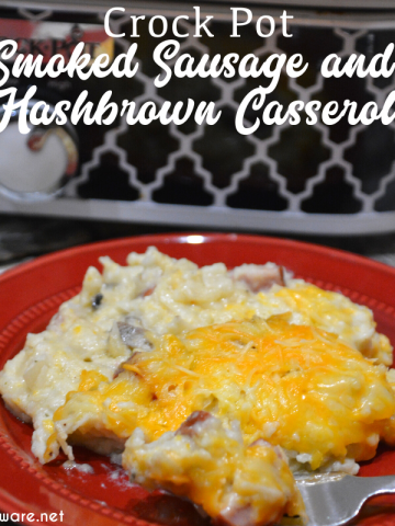 Crockpot smoked sausage and hashbrown casserole is a simple cheesy sausage and potato recipe made with frozen hash browns, sour cream, onions, cream of mushroom soup, smoked sausage, and shredded cheese that is a great weeknight meal in my beloved casserole crock pot.
