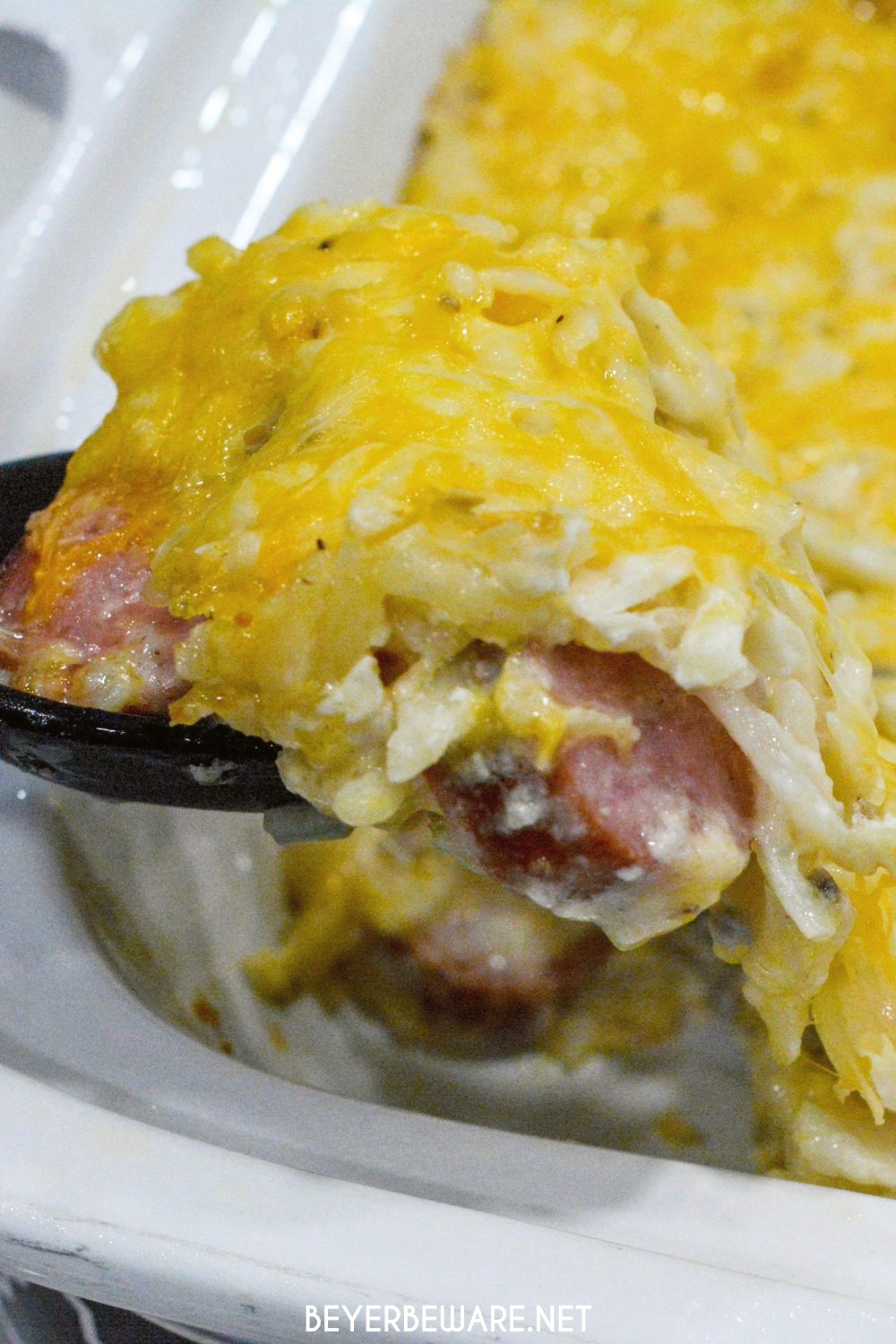 If you love funeral potatoes or hash brown casserole, you will love this casserole crock pot recipe that is filled with smoked sausage and hash brown casserole.