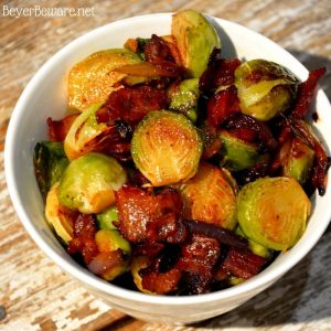 Sautéed Brussels Sprouts with bacon and onions are the way to eat Brussels Sprouts. Caramelized red onions with crispy fried bacon make these Brussels Sprouts full of rich flavor and melt in your mouth.