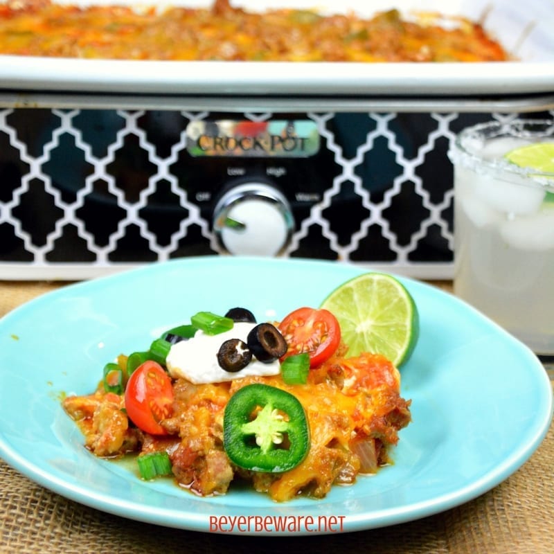 Crock Pot Low-Carb Taco Lasagna is full of ground pork or beef, cheese, salsa, onions and peppers for a satisfying and flavorful meal for people following a #Keto or low- carb diet plan. #Lowcarb #Lasagna