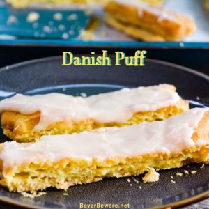 Almond Danish Puff Pastry has a flaky thin crust with a soft eggy bread layer that is drenched in almond flavoring and then covered with a light almond icing.