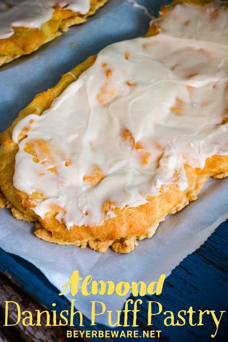 Almond Danish Puff Pastry has a flaky thin crust with a soft eggy bread layer that is drenched in almond flavoring and then covered with a light almond icing.