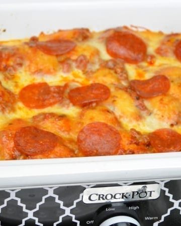 After three hours this crock pot bubble up pizza casserole was a cheesy goodness filled with our favorite pizza toppings. It is the perfect way to make a weeknight meal when you can't be home to put the casserole in the oven.