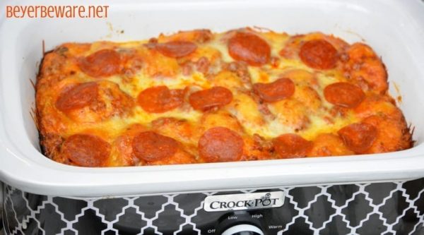After three hours this crock pot bubble up pizza casserole was a cheesy goodness filled with our favorite pizza toppings. It is the perfect way to make a weeknight meal when you can't be home to put the casserole in the oven.