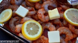 The Cajun pork burgers topped with shrimp and then drenched in a Cajun aioli combine ground pork, chorizo, with a Cajun seasoned horseradish mayonnaise for a perfect surf and turf burger recipe.