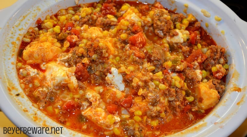This crock pot corn and sausage queso dip is spicy from the addition of chorizo with a hint of sweet from the corn sure to make it your new favorite cheese queso dip recipe.