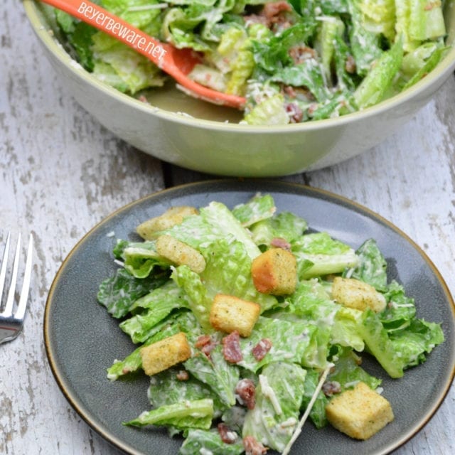 Toss the bacon caesar salad to combine. I wait to put the croutons on individually. Then they
