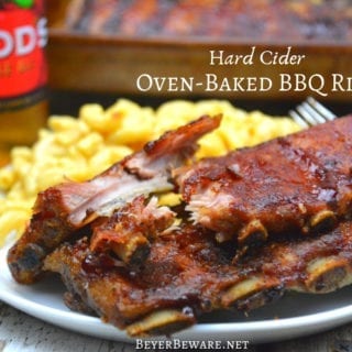 Hard cider oven-baked BBQ ribs are an easy combination of dry rub, hard cider, and barbecue sauce where the flavors meld together after hours of slow roasting.