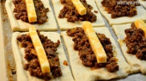 These sloppy joe sticks are handheld sloppy joes that meld meat and cheese together inside a burrito made from pizza crust.