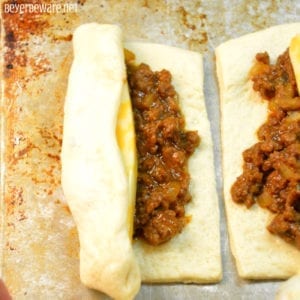 These sloppy joe sticks are handheld sloppy joes that meld meat and cheese together inside a burrito made from pizza crust.